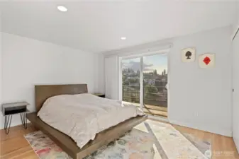 Main floor primary with access to the upper deck!  This is one of two primary suites