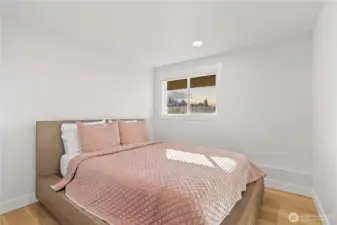 Fourth bedroom also enjoys the sunset skies in the lower level