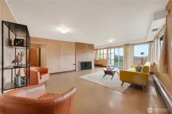 Bright and inviting lower-level hangout with a cozy fireplace and easy walk-out access to the backyard—perfect for game nights, movie marathons, or simply soaking up the indoor-outdoor vibe.