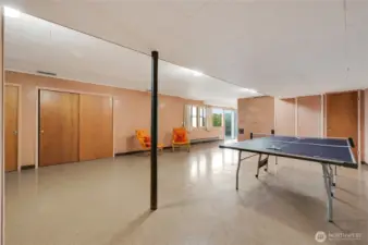 A bright and spacious second entertainment area on the lower level, perfect for ping-pong battles, game nights, or casual hangouts. With plenty of room to play and relax, it’s an ideal spot for fun, laughter, and making memories.