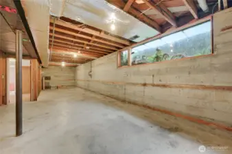 Spacious 700 sq ft unfinished basement with high ceilings—ideal for storage, future expansion, or creating additional living space. Clean, open layout with utilities conveniently located and ample natural light from a full-size window.
