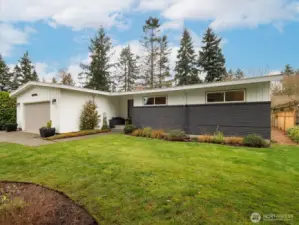 Experience the ultimate in mid-century modern ease in this updated 1956 rambler.