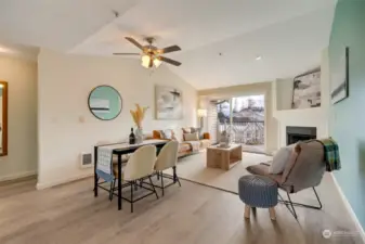 Greeted by vaulted ceilings & New Lifeproof LVP flooring in the kitchen, living, and hallway