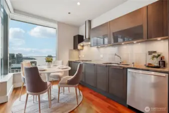 Kitchen & dining nook overlooking the city. Virtually Staged.
