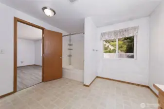 Primary bath with space to add extra storage or vanity space.