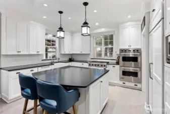 Beautiful kitchen opens to the family