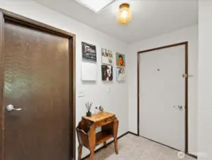 The two car garage opens into the entryway.