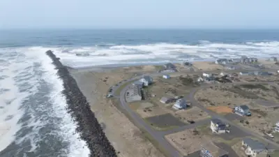 THIS DRONE PICTURE SHOWS THE SIDE VIEW OF THE CONDO OUT TOWARDS THE BAR AND PACIFIC OCEAN VIEWS!