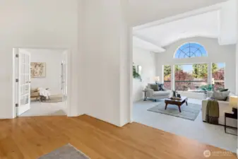 View of the great room and primary bedroom from the entryway