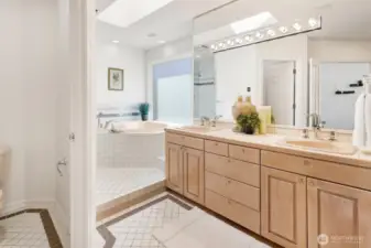 The main level primary bath is large and has a great layout with private toilet area, jetted tub, oversized shower, and double-sinks