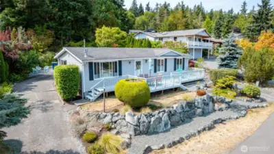 Crescent-shaped driveway with detached garage in the rear of the property.