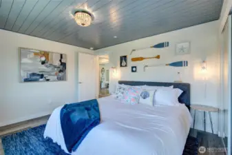 The second bedroom of Unit A is also comfortable appointed in a beach theme.