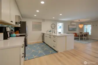 Off the kitchen is the laundry room.