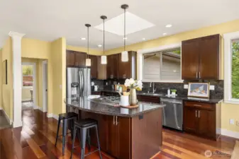Stunning chef's kitchen with slab granite countertops, SS appliances and water views.