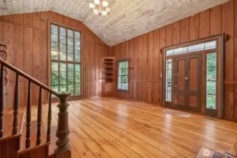 fantastic open great room, this is the original part of the home.  Ceiling was painted at some point and oils from the wood bled through.