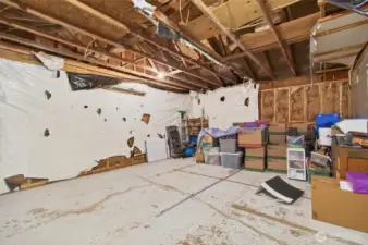 this area once had two garage doors that were removed.  the plan was to finish this for more bedrooms.