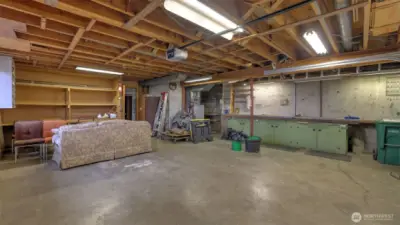 Enjoy a this oversized garage with ample storage and work space, ready for hobbyist!