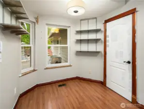 A bright and cozy kitchen nook featuring two pop-out windows that fill the space with natural light—perfect for morning coffee or casual meals.