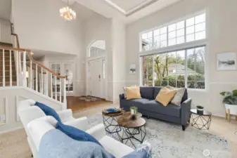 Off the entry is the spacious living room - or as many call it "The Christmas Tree Room", think of how tall your tree can be here? Two story entry and coved ceiling in the living room.