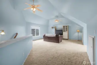 Another view of the bonus room with the stairs on the left. Many have used this for multigenerational living because the stairway comes out near the door from the garage into the house.