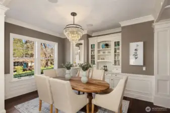 Stunning dining room with built-in buffet. Connects to kitchen through back entry.