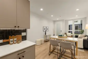 Enjoy the open flow from the kitchen to the dining and living areas. This layout is perfect for those who love entertaining or appreciate a spacious home environment.