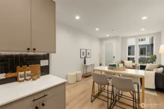 Enjoy the open flow from the kitchen to the dining and living areas. This layout is perfect for those who love entertaining or appreciate a spacious home environment.