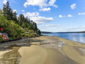 High tide and water comes up to the bulkhead. Low tide can be up to 300 yards of no bank sandy beach!