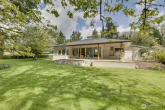 Large grassy backyard with access to Issaquah Creek. Property line is on the other side of the creek