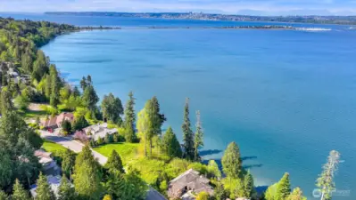 Clear blue waterfront stretching in all directions- prime location for a custom home.