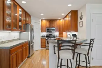 Check out the abundance of gorgeous cabinetry - all appliances stay.There's a pantry, too.