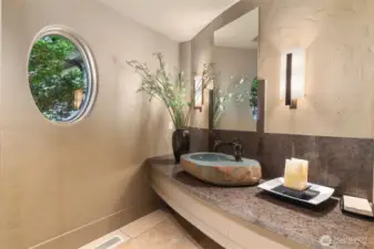 Many unique features such as this formed rock sink in one of the 1/2 baths