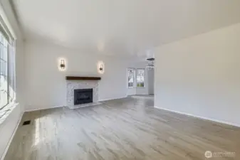 Gas fireplace surround upgraded in 2022 with sleek tiles and wood mantle
