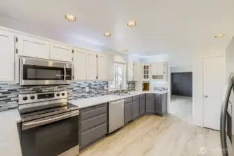 Appliance garage with built-in outlets, ideal for your KitchenAid mixer or Instant Pot. Kitchen flows seamlessly into the family room for easy entertaining