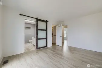 Thoughtfully designed en-suite bathroom with a linen closet to keep everything tidy and within reach
