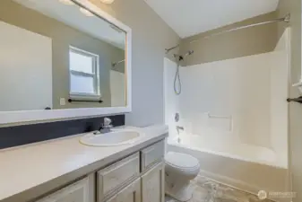 Soak or rinse, this bathroom offers a tub and shower combo to fit every kind of day