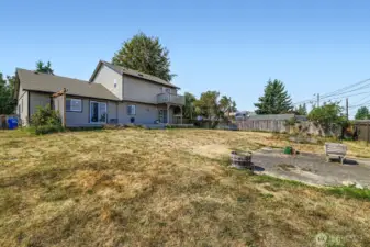 Twice the space, endless possibilities! This expansive double lot with alley access is perfect for outdoor living, expansion, workshop or investment