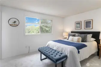 End your day in this airy and comfortable primary suite complete with private bath and relaxing natural light.