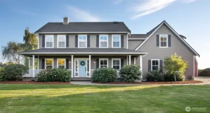 Mid-county living at its finest, wraparound deck and all.