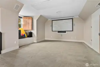 Projector, speakers, and retractable screen stay with the house!