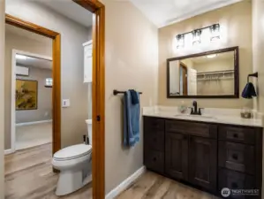Bathroom with mirrored vanity located across from the walk-in closet for the second upstairs bedroom