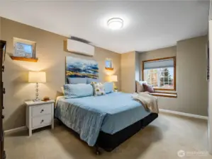 Second upstairs bedroom that mirrors the adjacent bedroom in size and layout