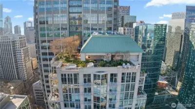 This beautiful rooftop oasis has fire pits, picnic tables, and lounge chairs for building residents.