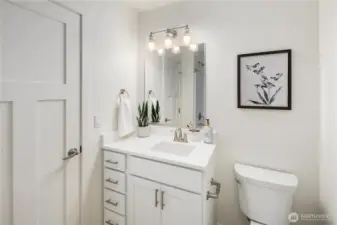 Upper-level full bath featuring modern vanity, updated fixtures, and clean contemporary finishes.