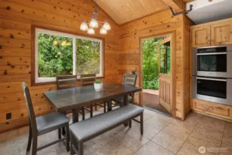 Eating nook off of kitchen with direct access to back deck.