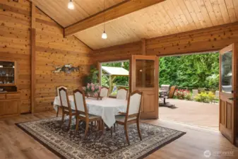 Dining area opening to back deck via french doors.