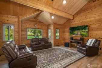 Living room framed with large windows allowing ample natural light to fill the space.