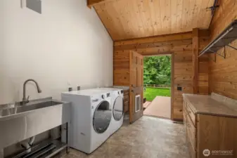 Spacious mud/utility room with direct access to back deck/yard.