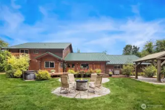 Backyard patio space with ample room for entertainment.