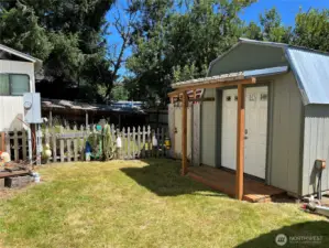 The backyard is completely fenced in for your furry companions. Septic hookups and electrical meter left side of photo.